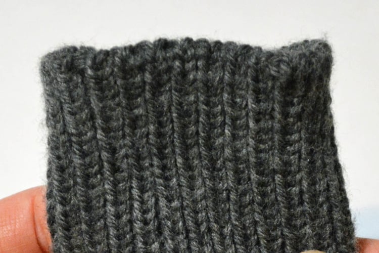 A ribbed sock cuff bound off smoothly in the pattern.