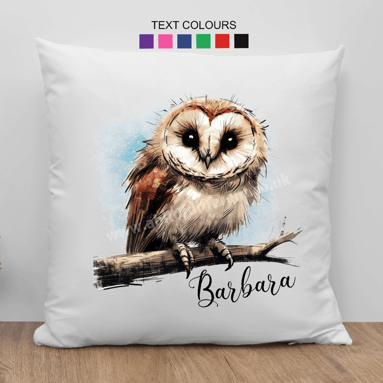 image of a barn owl sitting on a branch