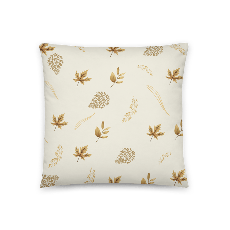 Throw pillow featuring repeating gold leaf silhouettes on a soft background for an elegant botanical look.