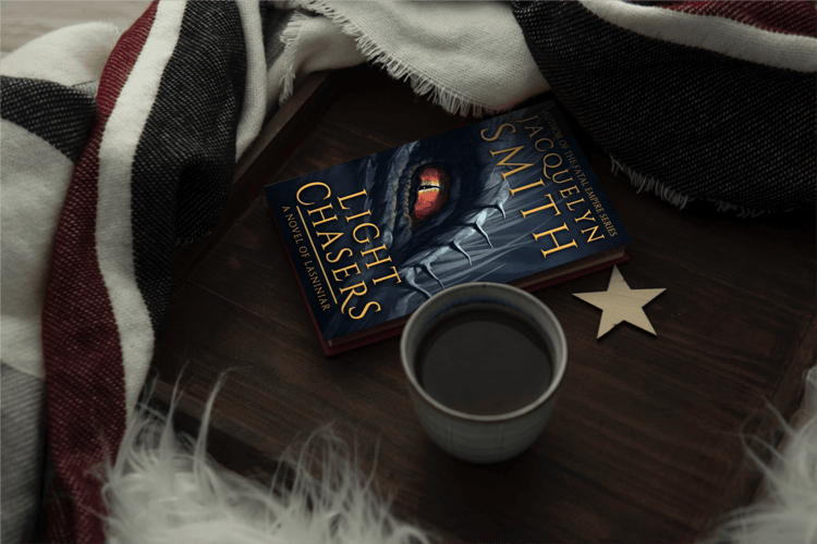 Light Chasers Lasniniar paperback with blanket and coffee