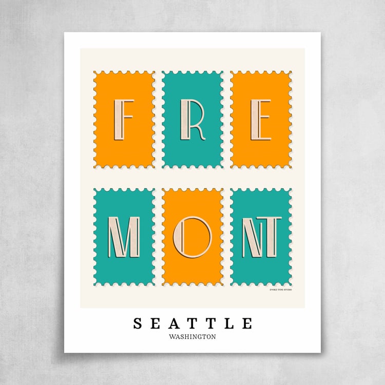 A collection of bright blue and orange postage stamps featuring the Fremont neighborhood in Seattle, Washington