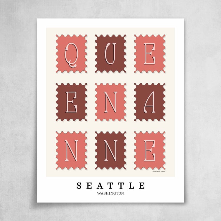 A collection of pink, burgundy and white postage stamps featuring the Queen Anne neighborhood in Seattle, Washington