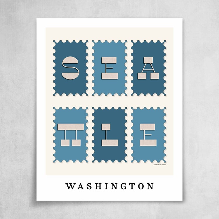 A collection of blue and beige postage stamps featuring Seattle, Washington