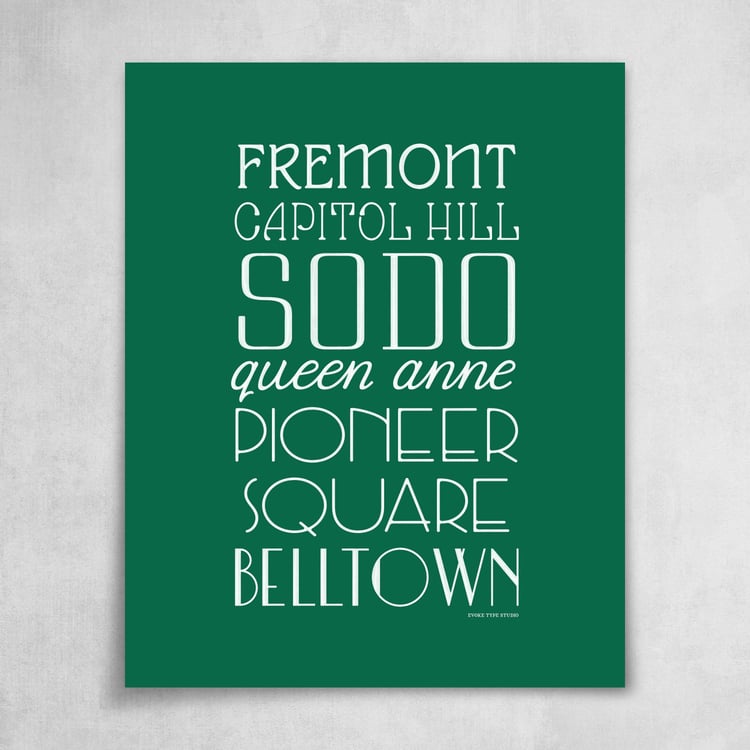 A collection of Seattle neighborhoods drawn in various lettering styles. Artwork has a green and white color scheme.