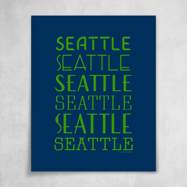 A collection of the word "Seattle" drawn in various lettering styles. Artwork has a bright blue and green color scheme.