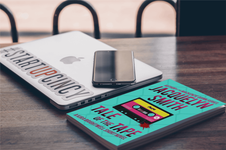 Tale of the Tape Kira Brightwell paperback wtih laptop and phone