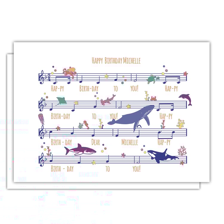 Greeting card illustration of Happy Birthday sheet music with colourful ocean sealife swimming across the notes