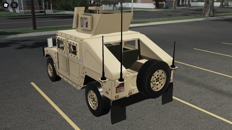 Military car parked on Roblox desert terrain
