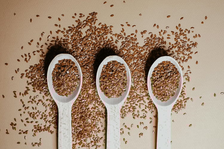 Ground flaxseeds in a bowl, fiber-rich superfoods to help lower blood sugar naturally and support diabetes-friendly meals.