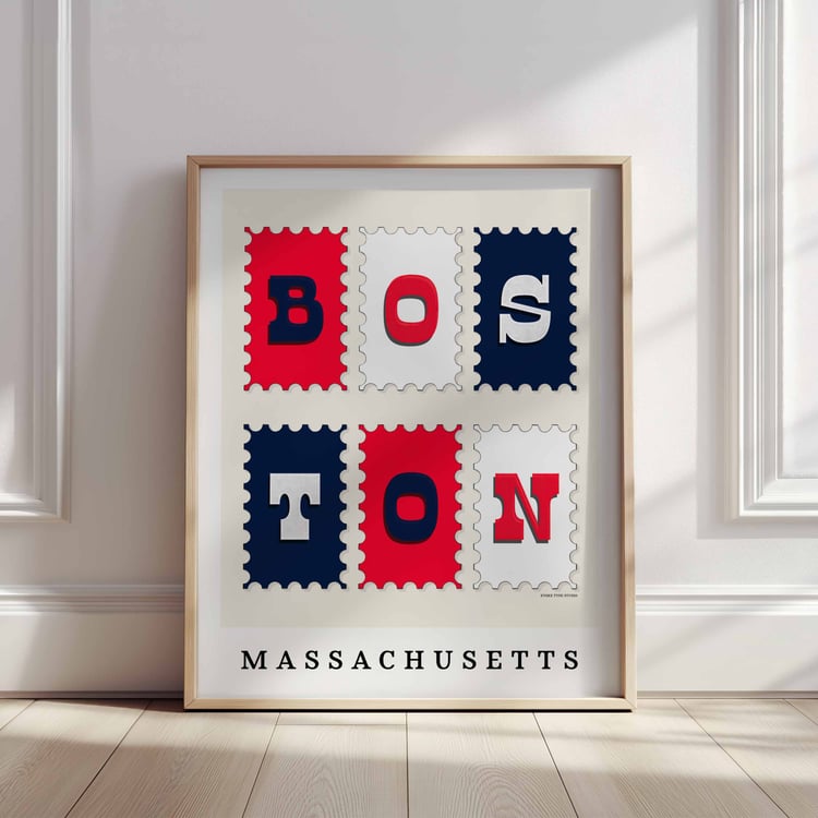 A framed picture of postage stamps featuring Boston, Massachusetts drawn in a unique lettering style. Artwork has a red, white and blue color scheme