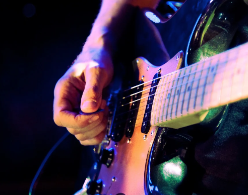 picking hand on an electric guitar