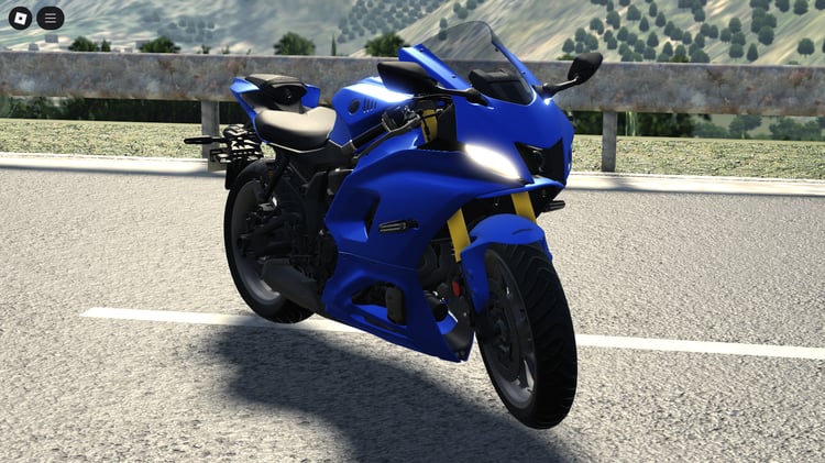Close-up of headlights, fairing, and aerodynamic design