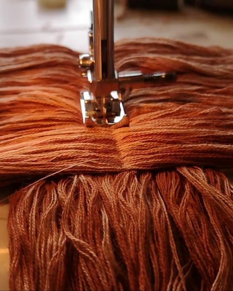 Sewing a ginger puppet wig – using a sewing machine to stitch yarn hair for a marionette.