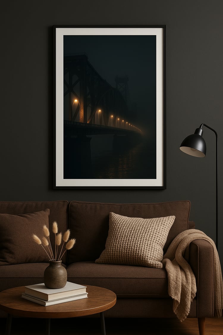 Dark aesthetic foggy bridge wall art displayed above a brown modern sofa with cozy textures and soft lighting in a cinematic living room