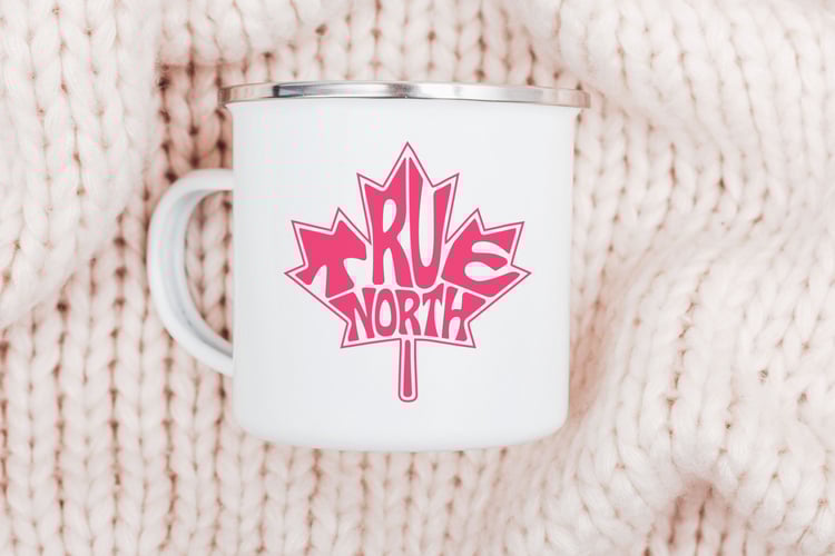 This design features the words True North creatively made into the shape of a maple leaf.
