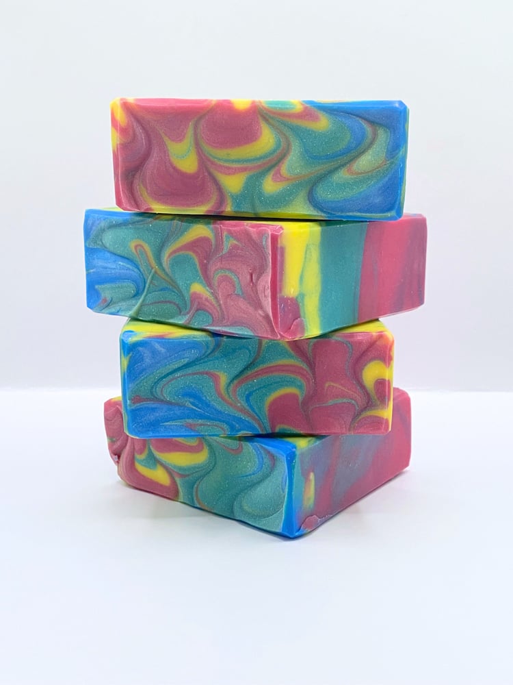 Handmade soap with swirls of yellow, blue, teal, and magenta