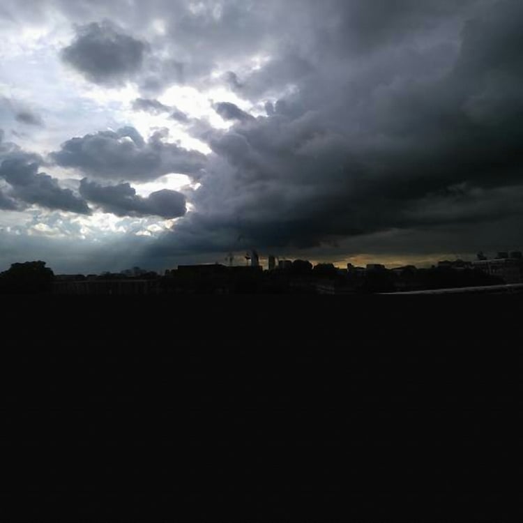 dark clouds over city