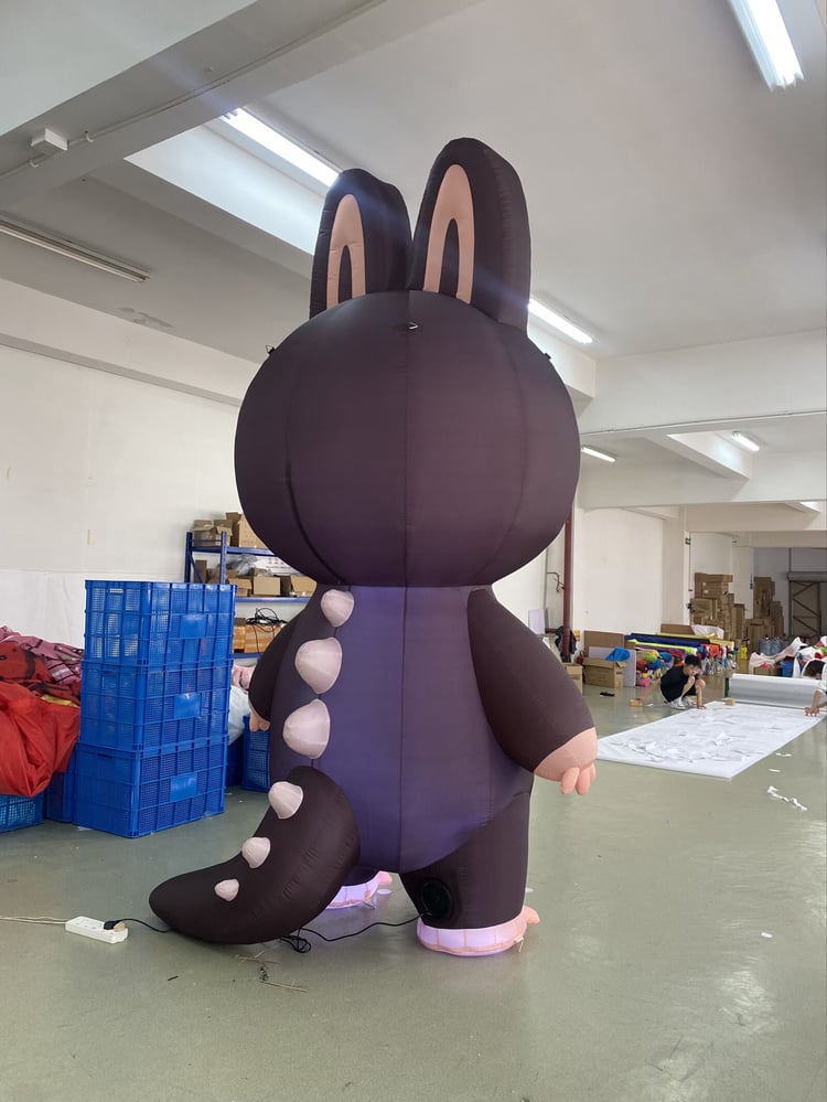 Large Labubu inspired inflatable decoration showing cute fangs and furry ears