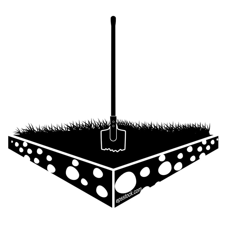 shovel in the ground with a pile of stones