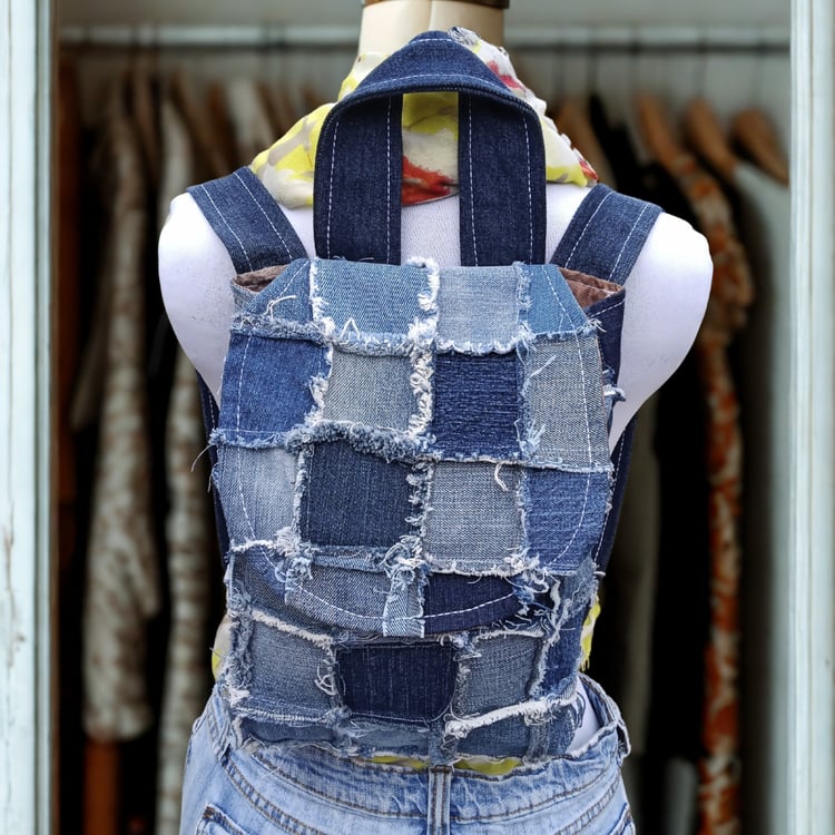 Handmade patchwork denim backpack with upcycled fabrics and vintage-inspired lining, crafted by What in Narnation.