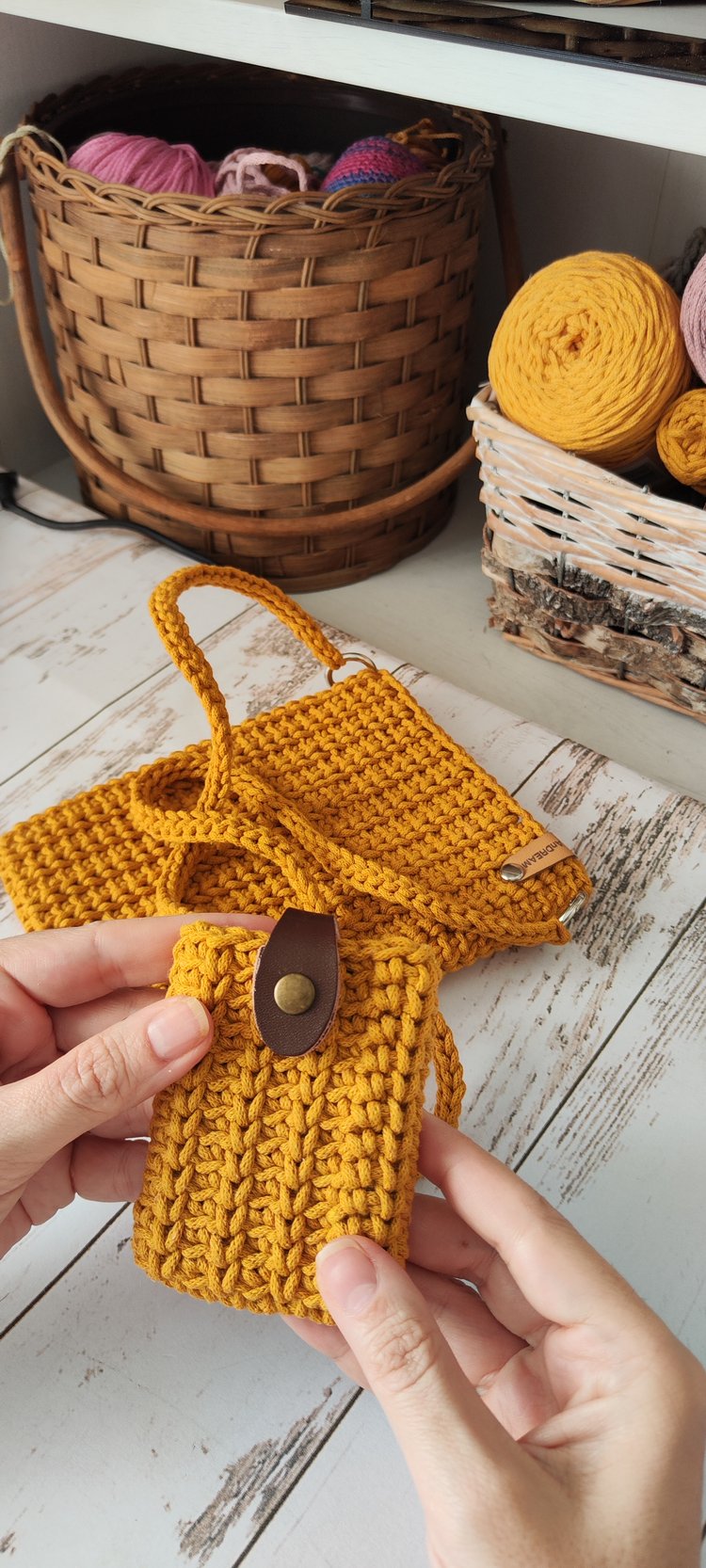 Four-colour collection of rope-yarn minimalist handbags (black, denim blue, mustard, dusty rose) arranged side by side, luxury handmade vibe