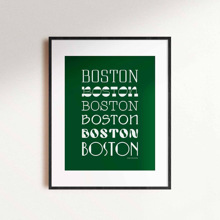 A framed picture of the word "Boston" drawn in various lettering styles. Artwork has a green and white color scheme