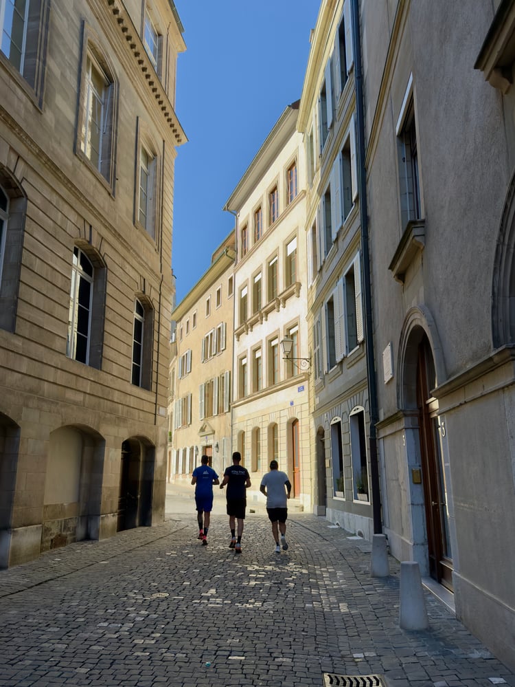 Runners on a road in Geneva Old Town (Vieille Ville), Switzerland