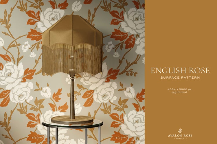Room with beige, white, orange, and gold vintage rose wallpaper with a table and gold lamp