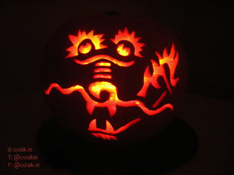 A printable dragon silhouette pumpkin carving stencil on a white background, perfect for a fantasy-themed Halloween lantern.