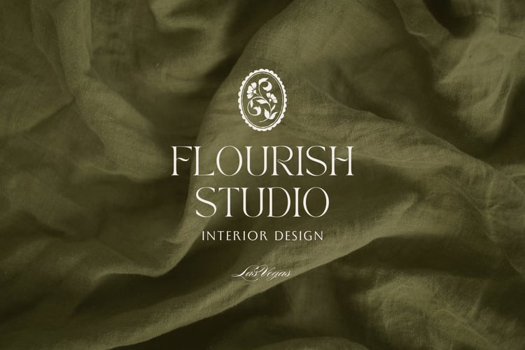 Logo design for Flourish Studio Interior Design with a hand drawn vintage floral illustration on a green fabric background