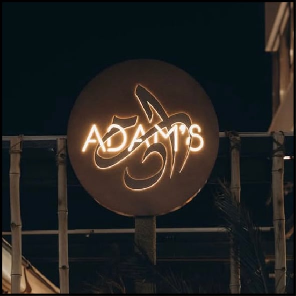 Arabic name logo design for “Adam” used at Adam’s Lounge restaurant by Tamer Hosny, showcasing custom Arabic calligraphy applied in real-world branding and restaurant identity