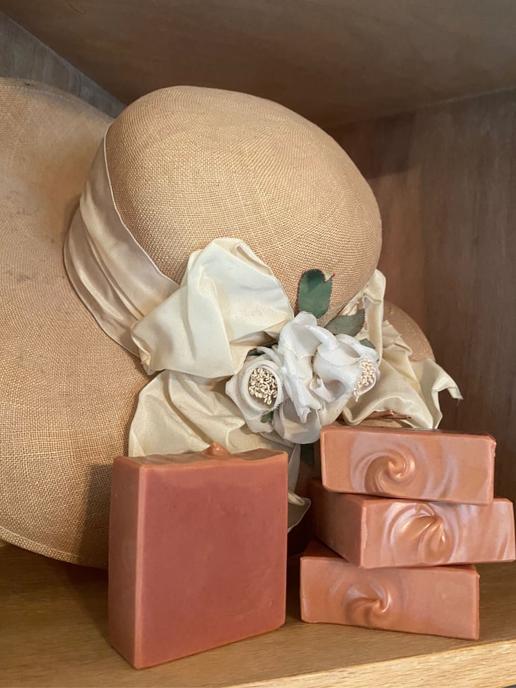 Madder root rose geranium handmade soap stack styled with a vintage hat