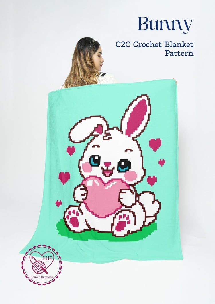 Bunny C2C crochet blanket finished project with pink bunny design on mint background