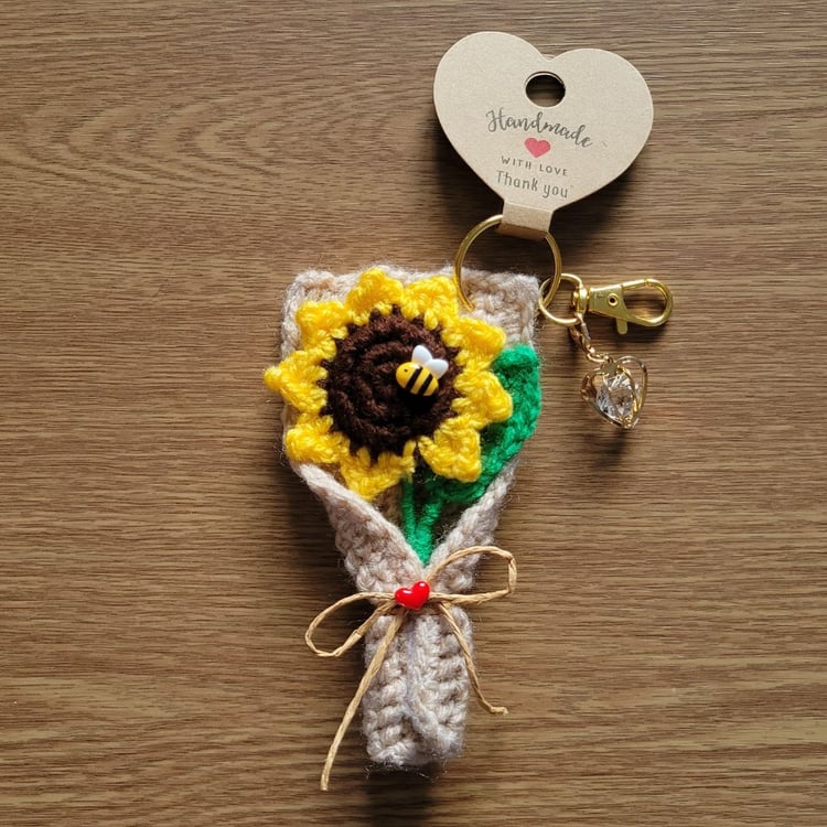 Crochet sunflower keychain with bee decoration and crystal heart charm, handmade floral gift