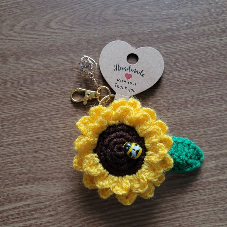 Handmade sunflower keychain with gold clasp and decorative heart pendant