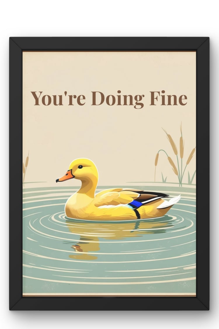 Youre Doing Fine duck wall art print in black frame, vintage 1970s illustration style, yellow duck on pond with cattails