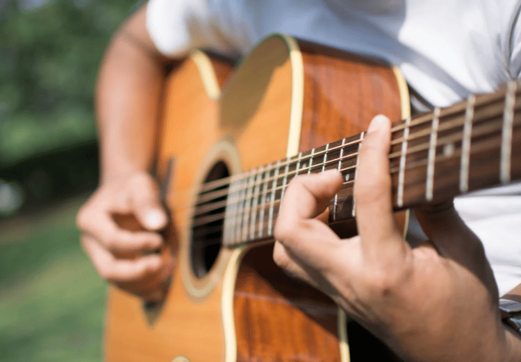 playing the acoustic guitar