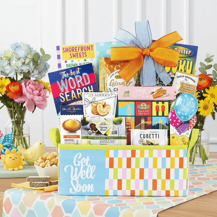 Colorful gift basket with Get Well Soon message on a table with flowers and books.