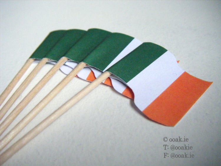 Sheet of 25 mini Irish Tricolour flags in green, white, and gold for DIY St. Patricks Day cupcake toppers and sandwich quarters.