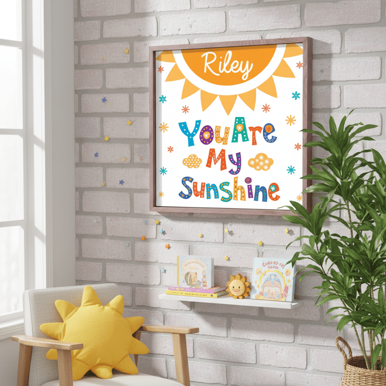 Decorative wall art with 'You Are My Sunshine' text in a colorful frame on a brick wall.