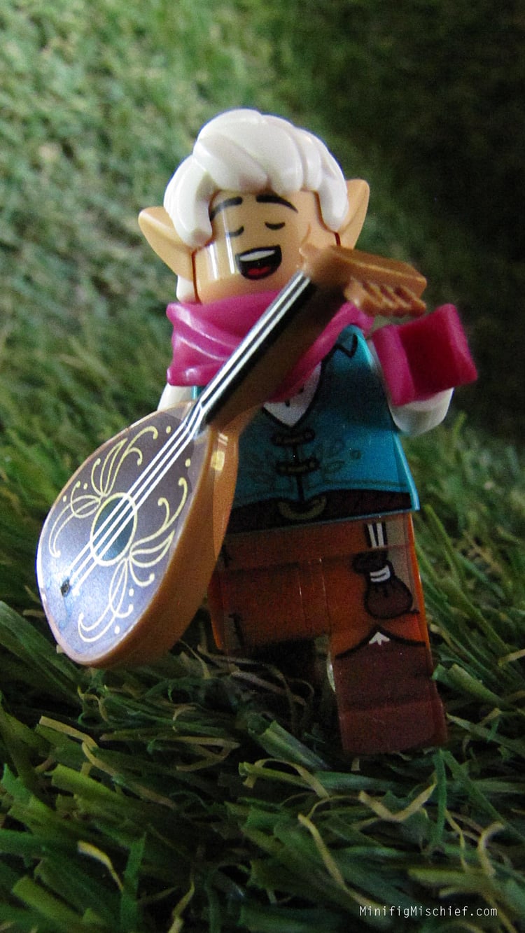 a lego elf minifig. he is holding a lute while singing.