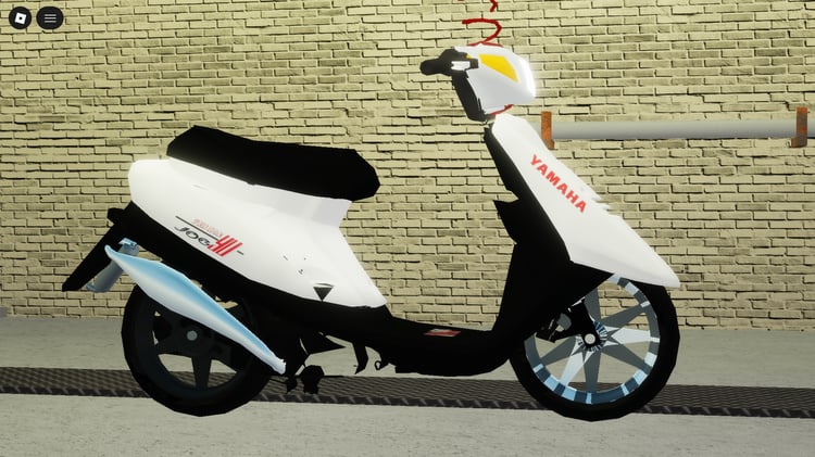 Small street scooter used as decoration in Roblox city scene