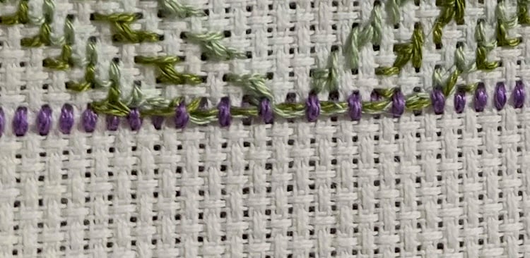 carrying thread across stitches