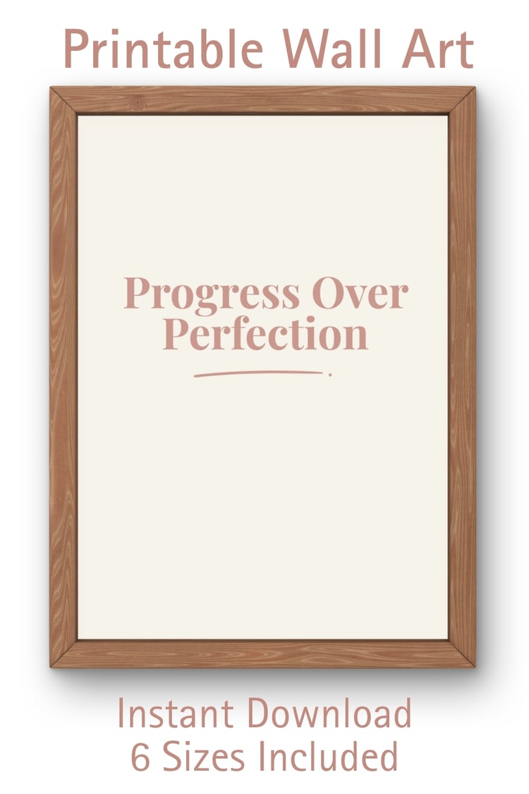 A terracotta typographic wall art print in a wooden frame on a white background with text reading Progress Over Perfection. Text overlay reads Printable Wall Art, Instant Download, 6 Sizes Included.