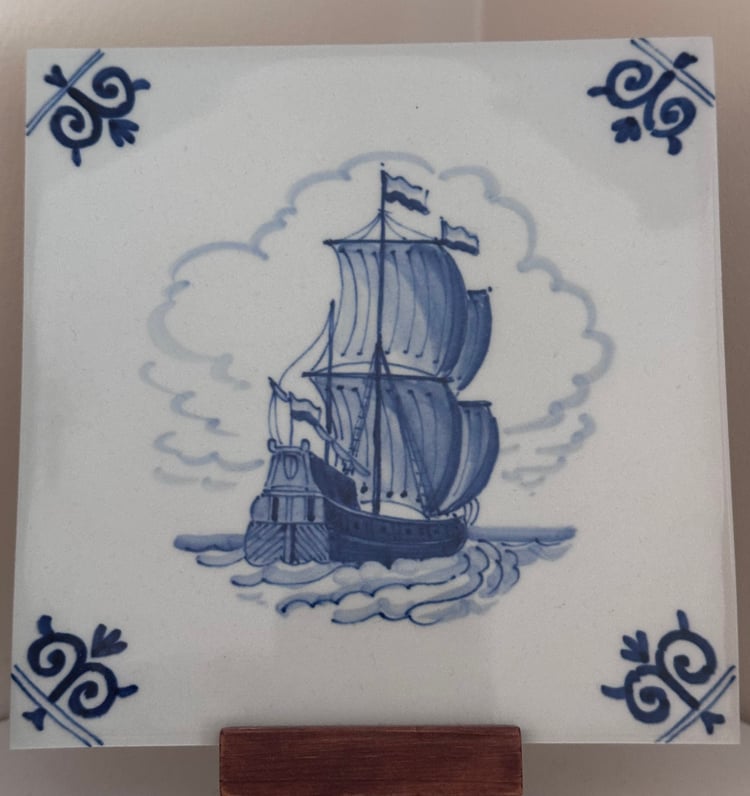 Delft tile pained with 3 masted ship.
