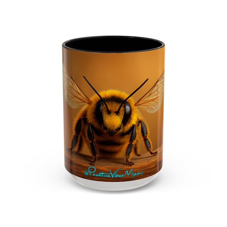“Front view of ceramic mug featuring a delicate bee surrounded by warm, uplifting colors.”
