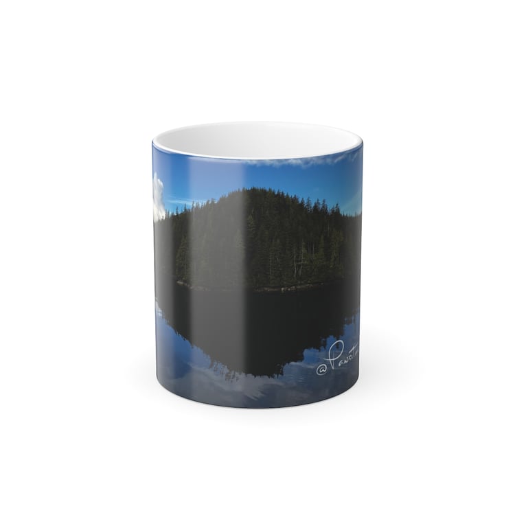“Heat‑reveal mug showing an Alaska island reflection emerging as the mug warms.”