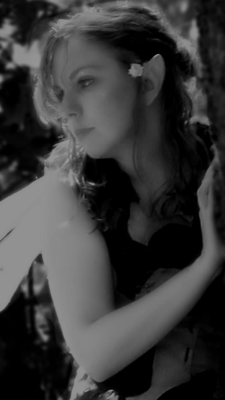 Fairy watching from a tree