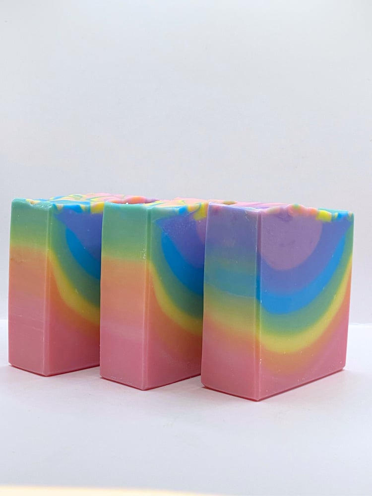 three handmade soaps in a rainbow design