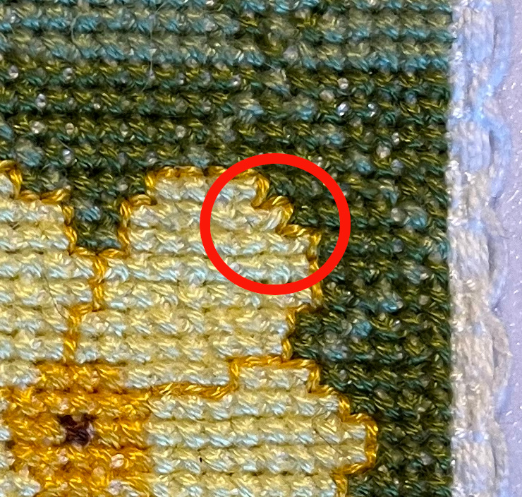 Close up of unintended half cross stitch